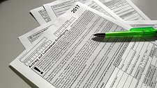 Seiten einer Steuererklärung und Stift